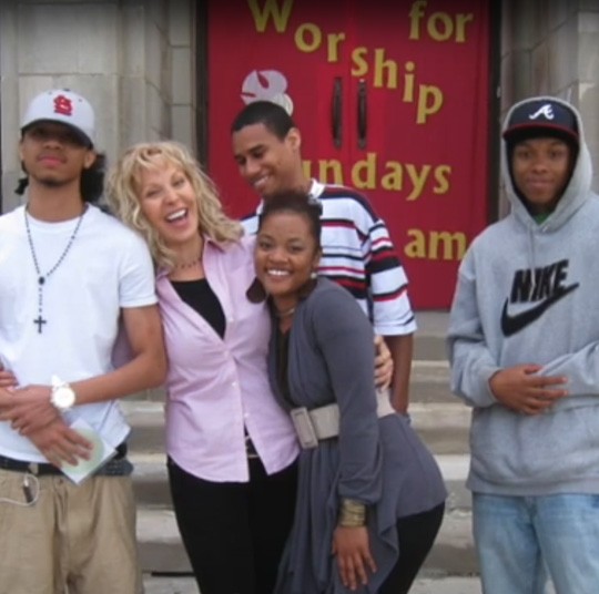 Marlise Karlin laughing with diverse group of students